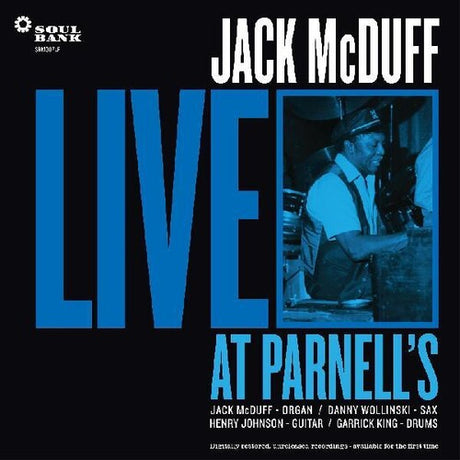 Cover of the album 'Live At Parnell's' by Jack McDuff, featuring a black and white photo of a smiling man on the organ with a blue text background.
