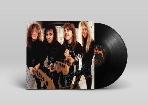 Vinyl record with a band photo on the cover against a gray background