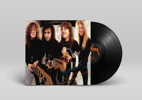 Vinyl record with a band photo on the cover against a gray background