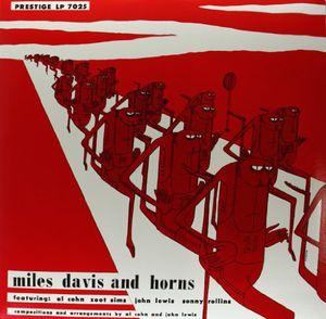 Album cover with red silhouettes of ants and text on a red background