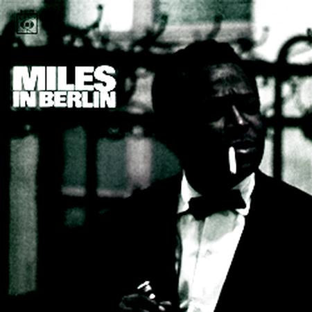 Album cover with a person in formal attire and 'Miles in Berlin' text.