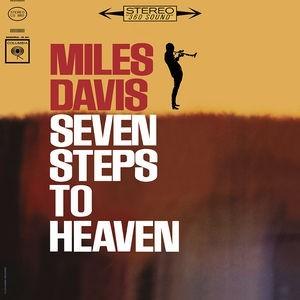 Album cover of 'Seven Steps to Heaven' by Miles Davis with a silhouette of a person playing a trumpet.