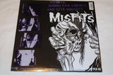 The image displays the cover art for the Misfits album 'Die Die My Darling', featuring a black and white comic-style illustration.