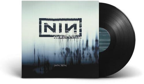 A vinyl record of Nine Inch Nails' album 'With Teeth' with a stylized water splash cover art.