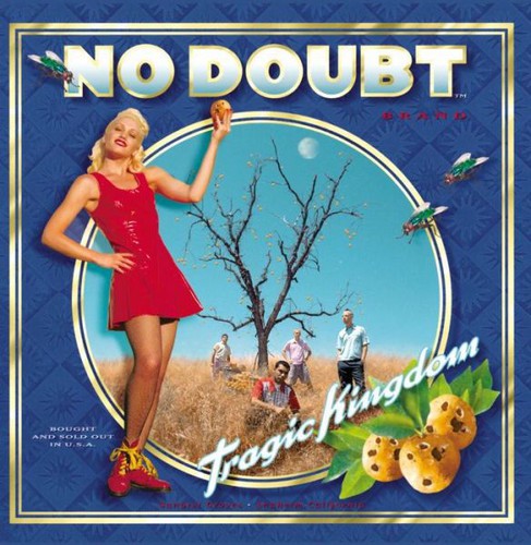 Album cover of No Doubt - Tragic Kingdom featuring a woman in a red dress against a whimsical background with trees and a bird.