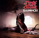 Ozzy Osbourne album cover for 'Blizzard of Oz' featuring Ozzy in a dramatic pose with a sword and backdrop consistent with the metal genre.