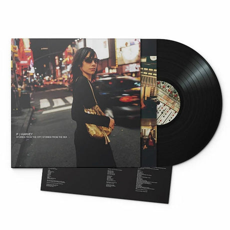 A black vinyl record album of PJ Harvey's album 'Stories From The City, Stories From The Sea' with a picture of PJ Harvey on the cover.