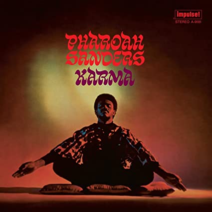 Pharoah Sanders album cover for 'Karma' showing a black and white image of Sanders with a red and purple tinted background.
