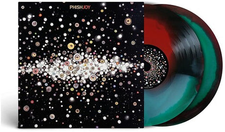 A vinyl record album titled 'Phish - Joy' featuring a space-themed cover with numerous white dots arranged in intricate patterns against a dark background, with a visible red and blue vinyl record beneath.