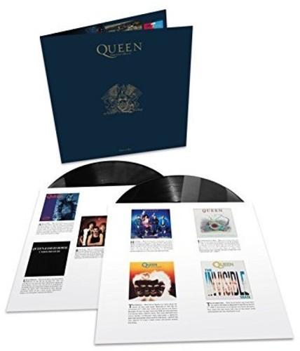 Two vinyl records protuding from their inner sleeves with the cover standing behind them.