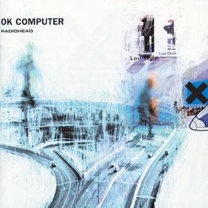 Album cover art for Radiohead's OK Computer, featuring a blurred, abstract depiction of a cityscape.