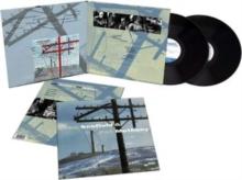 Vinyl record with cover featuring images of power lines and landscapes
