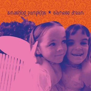Album cover art for Smashing Pumpkins' Siamese Dream featuring two young children smiling closely together.