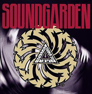 Soundgarden album cover for 'Badmotorfinger' featuring a graphic design with a central triangle and interlocking spirals in a dark, red-textured background.