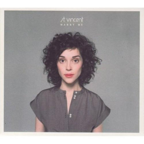 This image features the cover art for the vinyl record "Marry Me" by St. Vincent, which is the moniker of musician Annie Clark.