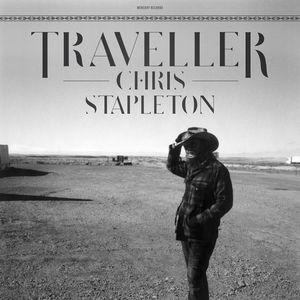 A black and white album cover featuring Chris Stapleton standing in a wide open space with a hat on his head.