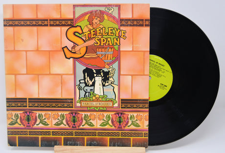 Steeleye Span - Parcel Of Rogues vinyl record album cover featuring a cartoon illustration of a character and a rook (bird).