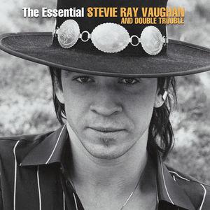 Album cover featuring a person wearing a wide-brimmed hat with decorative elements, set against a blurred natural background.