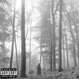 A beige vinyl record labeled 'Folklore' by Taylor Swift, with an image of a person in a woodsy setting on the cover.