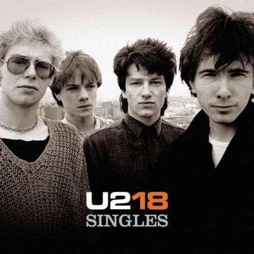 a black and white cover of the four members of U2 standing together