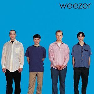 A vinyl record cover featuring four members of the American rock band Weezer, posing against a blue background.