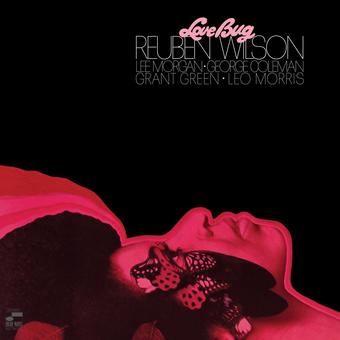 Limited edition vinyl LP cover for Wilson, Reuben - Love Bug featuring a stylized image of a woman with butterfly wings in a pink hue, with the artist and track name at the top.