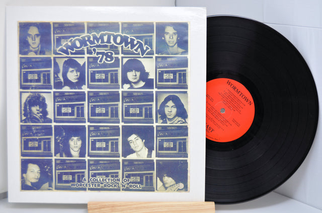 Vinyl record and front cover of the various artist compilation record from Worcester, MA titled 'Wormtown '78' showing pictures of some band members and the outside of a bar.