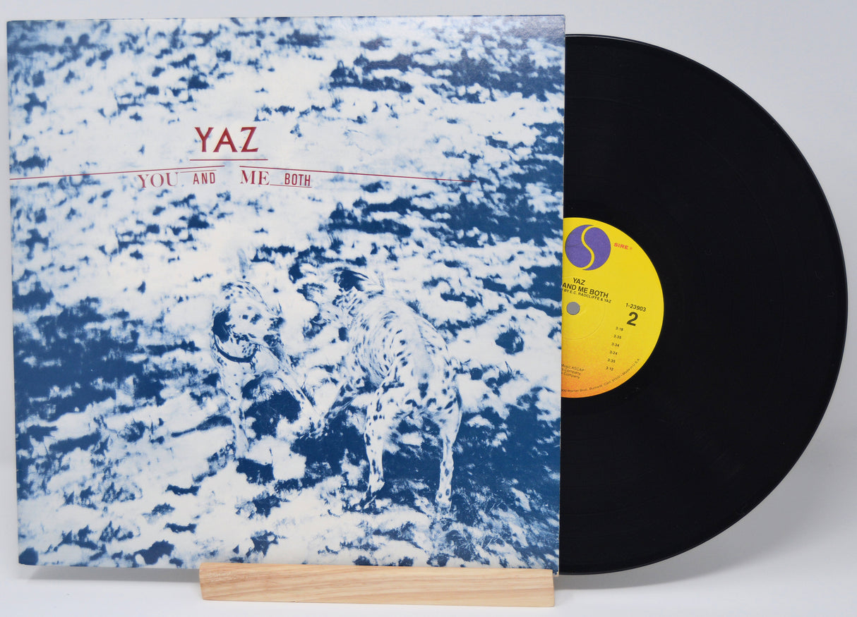Vinyl record with a blue and white abstract cover and yellow label