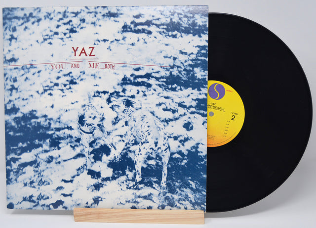 Vinyl record with a blue and white abstract cover and yellow label