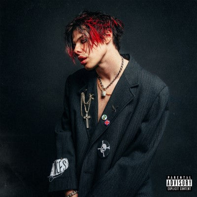Front cover of Yungblud Self Titled CD showing a picture of him in black clothes against a black background.