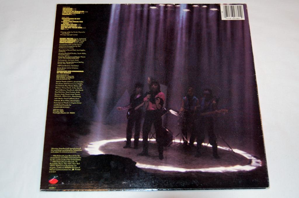 Vinyl record back cover for the self titled release by the band Zot.  I shows a picture of the band and yellow text for song titles and credits.