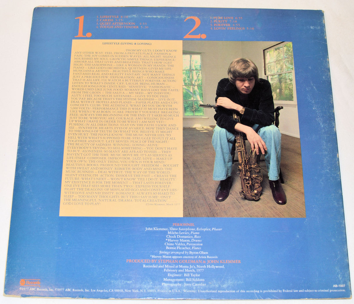 Back cover of John Klemmer, Lifestyle vinyl record with a picture of him and text.