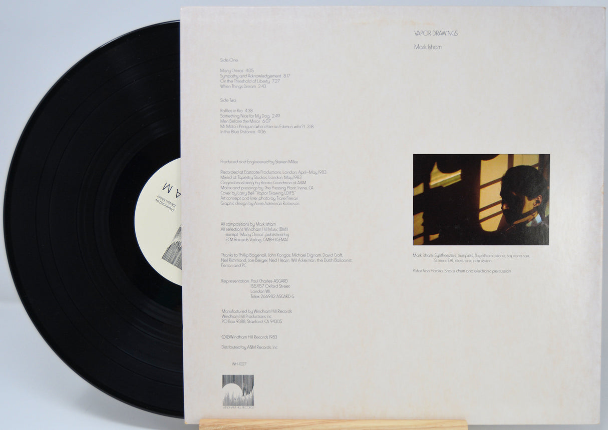 Vinyl record titled Vapor Drawings by Mark Isham showing the back cover with shows the song titles in text.