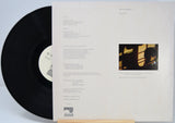 Vinyl record titled Vapor Drawings by Mark Isham showing the back cover with shows the song titles in text.