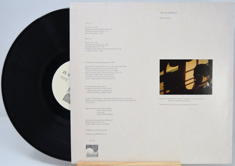 Vinyl record titled Vapor Drawings by Mark Isham showing the back cover with shows the song titles in text.